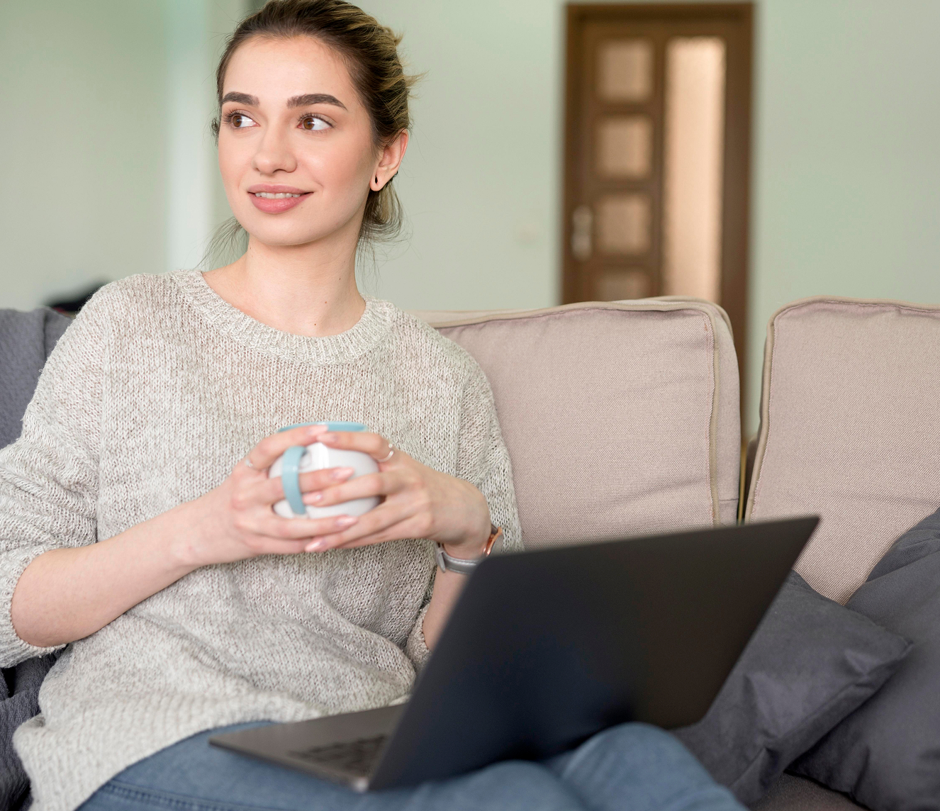 freelance-woman-couch-working-laptop 1