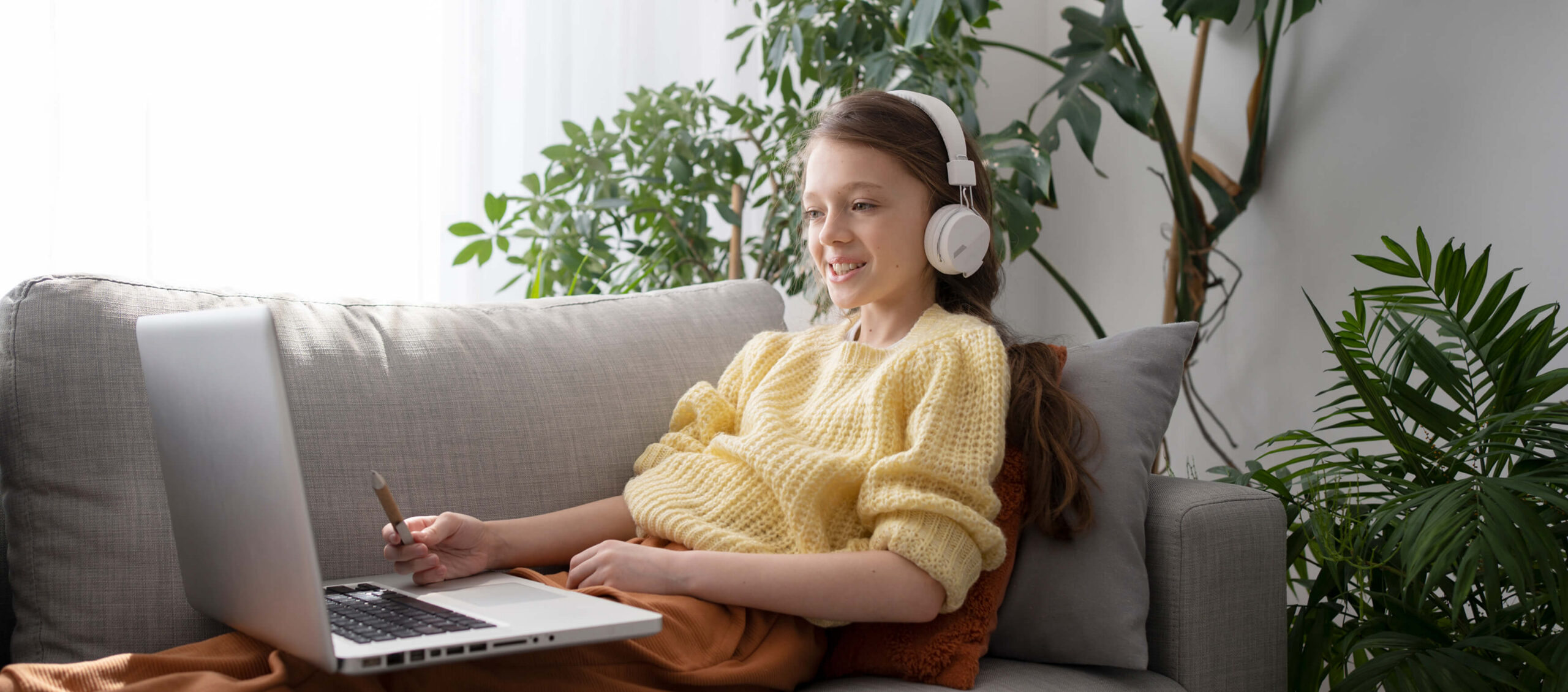 https://myuniquetherapy.com/wp-content/uploads/2026/02/side-view-girl-with-laptop-couch-1-scaled.jpg
